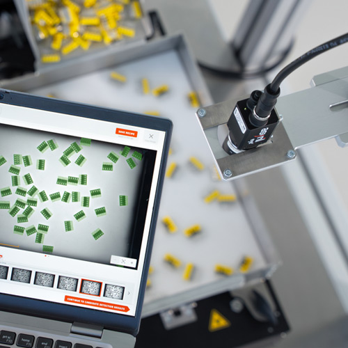 Asyril Vision inspecting parts on feeder